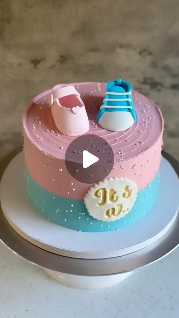 Ankita Dutta | CAKE ARTIST on Instagram: "Gender reveal cake! 💗💙 I’d already made one of these a few months ago. I always enjoy this style — it’s simple, but effective. So satisfying to seal up the secret inside — and such a great reveal when you cut into it! The cake is eggless chocolate, with chocolate buttercream between the layers (and *pink* candy within). All decorations are made of fondant, and 100% edible. Aren’t the shoes super cute ☺️ #genderrevealcake #genderrevealcakes #egglesscakes #egglesscake #egglessbaking #egglessbakes #cakeideas #cakeartist #cakedecorator #cakecakecake #cakedesigner #buttercreamcakedesign #cakereels #cakereel #cakereelsofinstagram #cakereelsvideo #cakesgram #cakeinstagram #fremontbaker #bayareabaker #bayareacakes #instacakers #instacakedesign #naanba Desserts Gender Reveal, Gender Reveal Cake Videos, How To Make A Gender Reveal Cake, Baby Gender Cake Ideas, Baby Shower Cake Designs Simple, Gender Torte, Simple Baby Shower Cake Ideas, Gateau Gender Reveal, Easy Gender Reveal Cake