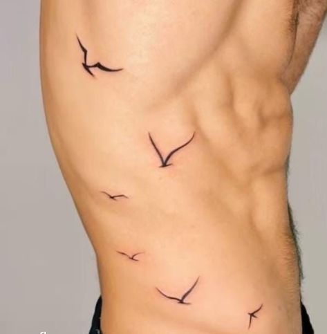 Minimalist Wrist Tattoo Men, Birds On Ribs Tattoo, Flying Bird Tattoo Men, Side Rib Tattoo Men, Birds Tattoo Men, Small Bird Tattoo Men, Bird Tattoos Men, Rib Tattoos Men, Bird Rib Tattoo