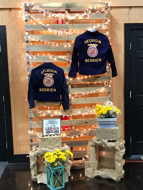 Decorations for FFA Banquet- displaying administrators' FFA jackets! Ffa Photo Booth, Ffa Jacket Display, Ffa Fair Booth Ideas, Ffa Week Dress Up Days, Ffa Decorations Banquet, Ffa Banquet Centerpieces, Ffa Backdrop, Ffa Graduation Party Ideas, Ffa Week Ideas