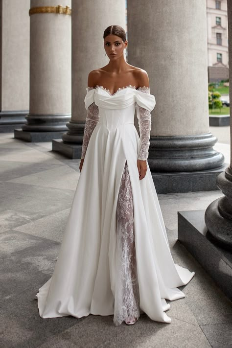 ❤️ ABOUT Step into timeless elegance with our lace-up A-line wedding dress. This exquisite gown features delicate lace sleeves that drape gracefully off the shoulders, creating a captivating cold-shoulder effect. The dress boasts a flattering corset bodice and a dramatic split skirt, which naturally forms soft folds over the delicate lace undergown, revealing a hint of leg. A flowing train adds a touch of sophistication, making this dress perfect for a bride seeking both romance and modernity on Basque Waist Wedding Dress With Sleeves, Wedding Dress With Detachable Sleeves, Radiate Confidence, Exquisite Gowns, Dress With Pleats, Cold Shoulder Lace, Long Sleeve Wedding Dress Lace, Wedding Dresses Corset, Corset Bodice