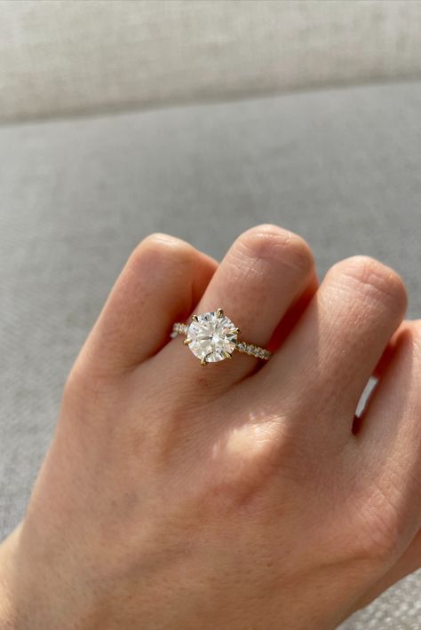 Round solitaire engagement ring