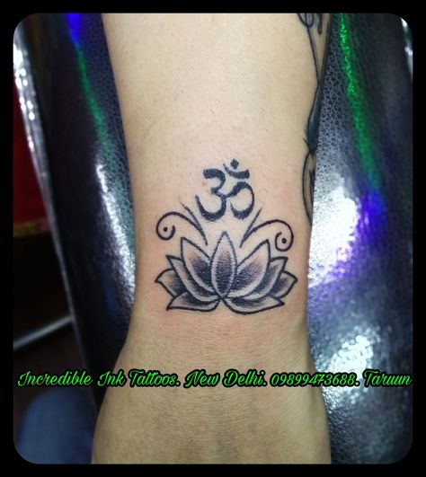 #Om #Lotus Om Lotus #Tattoo Tattoos Call and what's app 09899473688 Om And Lotus Tattoo, Lotus Om Tattoo, Om Chakra Tattoo, Om Lotus Tattoo, Ohm Tattoo, Om Symbol Tattoo, Hindu Tattoos, Wrist Tattoo Cover Up, Chakra Tattoo