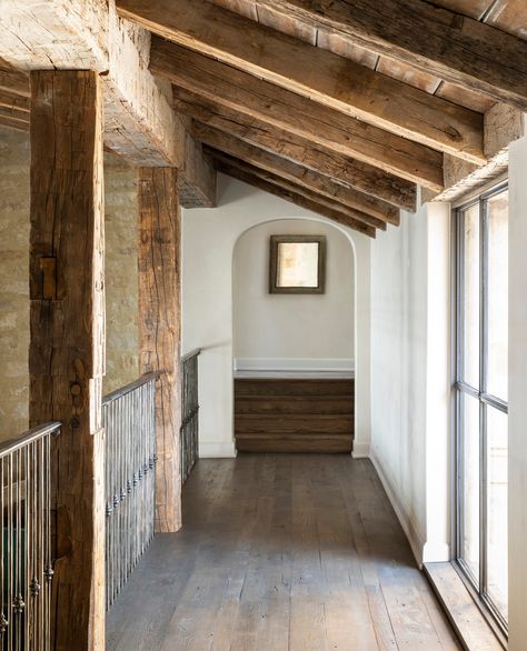 Catwalk In House Interior Design, Rustic Ranch Interior, Beams On Ceiling Living Room, Hallway With Beams, Texas House Interior, Timberframe Interiors, Limestone Interior, Modern House In The Woods, Modern Rustic Lake House