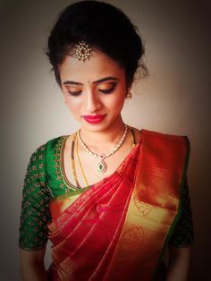 Traditional Southern Indian bride wearing bridal silk saree and jewellery. Reception look. Makeup and hairstyle by Swank Studio. <a class="pintag searchlink" data-query="%23BridalSareeBlouse" data-type="hashtag" href="/search/?q=%23BridalSareeBlouse&rs=hashtag" rel="nofollow" title="#BridalSareeBlouse search Pinterest">#BridalSareeBlouse</a> <a class="pintag searchlink" data-query="%23SariBlouseDesign" data-type="hashtag" href="/search/?q=%23SariBlouseDesign&rs=hashtag" rel="nofollow" title="... Red Silk Saree With Green Blouse, Hairstyles On Saree, Green Blouse Designs, Hairstyles For Indian Wedding, Saree Hairstyles, Wedding Saree Blouse, Hairstyles Indian, Sleeve Embroidery, Wedding Blouse Designs