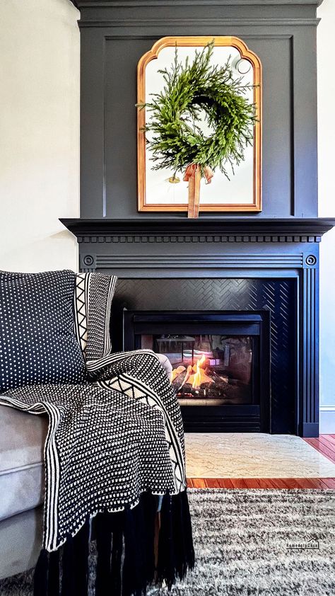 Fireplace makeover in family room. Dark Painted Mantle, Colored Fireplace Painted, Dark Painted Fireplace, Black Fireplace Makeover, Dark Fireplace Mantle, Painted Mantle Ideas, Vintage Fireplace Ideas, Painted Fireplace Surround, Black Fireplace Ideas