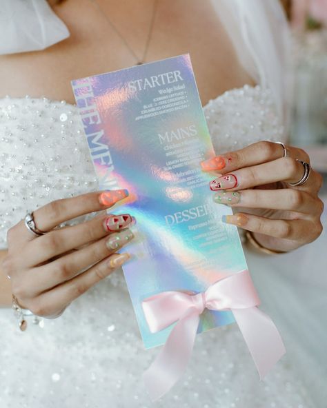 ✨ Just got the gallery back from an incredible holographic and iridescent inspired styled shoot! 🌈💫 The colors, the shimmer, the magic—everything came together so beautifully. I had the absolute joy of creating custom menus that perfectly matched the ethereal vibe of the whole setup. Each menu sparkled with a touch of whimsy, reflecting the light in the most perf way. 🌟🍽️ Seeing my designs come to life in such a dreamy setting was like a fairytale. Imagine this for your big day! 😍 If you're ... Iridescent Themed Wedding, Future Wedding Plans, Wedding Signage, Menu Cards, Menu Design, Wedding Color Schemes, Place Cards, The Gallery, Styled Shoot