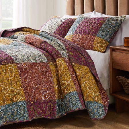 Accent your space with Mid-Century Modern styling. Retro paisley prints in a kaleidoscope of colors lighten the mood and coordinate with a variety of home decor palettes. Quilt set comes with quilt and two pillow shams (one sham per Twin set). Complimentary print on reverse for two looks in one. Zippered side closure on shams make each truly reversible. Oversized for better coverage on todays deeper mattresses. Machine quilted with fabric bound edges for durability and surface interest. Dimensio Bohemian Comforter, Paisley Quilt, Bohemian Quilt, Cotton Quilt Set, Block Quilt, Eclectic Bedroom, Home Office Lighting, Future Apartment, Smart Furniture