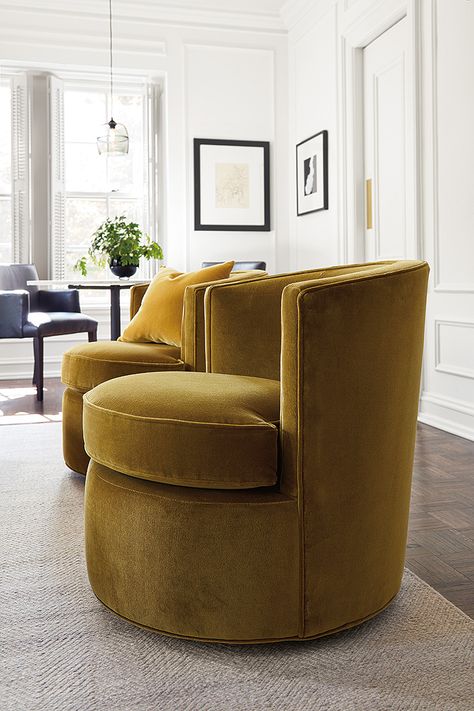 Modern Otis swivel chairs in velvet fabric. Our Otis chair is a modern version of the classic tub chair, so it’s a perfect bridge between the traditional style of this condo and the updated furniture within it. Otis is petite enough to fit in small spaces but is packed with comfort and features smooth-moving swivels. Not to mention, Otis looks great in pairs. Modern Swivel Chair, Upholstered Swivel Chairs, Leather Swivel Chair, Swivel Chair Living Room, Swivel Chairs, Sofa Living, Modern Lounge Chairs, Comfy Chairs, Modern Furniture Living Room