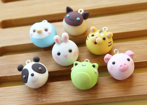 These adorable animal buns are your next best friend! Available in seven flavors, these collectible charms will add the perfect touch of cute to anything! Charms are handmade with polymer clay and sealed with a coat of polyurethane.  Animal bun charms are about 1.6 cm in diameter. Dimensions may vary slightly from charm to charm. Available in seven flavors! -Frog -Panda -Cat -Rabbit -Penguin -Pig -Tiger Please handle with care! The charms can be very gently washed, however please avoid prolonged Polymer Clay Charms, Clay Charms, Buns, Best Friend, Polymer Clay, Charms, Animals