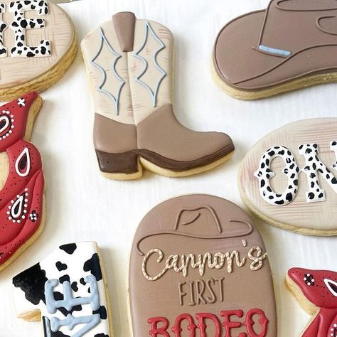 Las vegas custom cookies on Instagram: "Cannons first rodeo 🤠❤️ • • • • • • #decoratedcookies #royalicingcookies #cookiesofinstagram #cookies #cookieartist #cookieart #customcookies #cookiedecorating #sugarcookies #sugarcookiesofinstagram #dessert #hendersoncookies #lasvegascookies #lasvegascookier #lasvegasbaker #decoratedsugarcookies #selftaught #selftaughtcookier #firstrodeocookies #rodeocookies #cowboycookies #cowboybootcookies #bandanacookies #firstbirthdaycookies" Rodeo Themed Cookies, 1st Rodeo Cookies Boy, Rodeo Decorated Cookies, My First Rodeo Birthday Cookies, Cowboy Hat Sugar Cookies, 1st Rodeo Birthday Cookies, First Rodeo Cookies Boy, 1st Rodeo Cookies, Rodeo Cookies Decorated