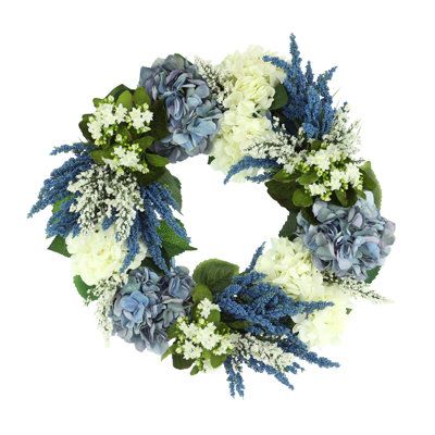 Experience the beauty of this gorgeous 26" wreath. Adorned with an array of enchanting blue and white hydrangeas, blue heather and added lilac, it will bring refreshing colors to any room in your home. The best part? You don't have to wait for spring; you can have the vibrant colors of this stunning wreath right at your doorstep! Hang it up today and admire its simple beauty - it is sure to be the perfect addition to your living space. Creative Displays, Inc. 26" Assorted Hydrangea, Heather and Lilac Wreath, Hydrangeas Blue, White Hydrangeas, Wreaths Diy, Creative Display, Pet Gate, Summer Gifts, Baby Organization, White Hydrangea