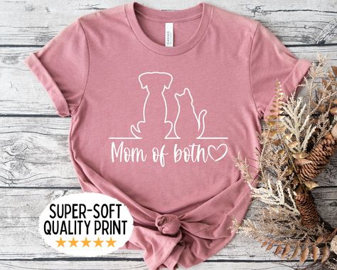 This cute mom of both shirt is the perfect gift for any fur mama who is both a dog mom AND a cat mom! Our Unisex T-shirts are High Quality, SUPER soft and SUPER comfy. They are made of 100% Cotton. Heather tees are a soft cotton-poly blend. Tees are Bella+Canvas 3001 Unisex  HOW TO ORDER * Please check all photos from the listing. * Please check all size chart measurements ( width and length) before size decision. * Please choose your shirt size (pay attention to style listed with each size). * Click add to cart. If you would like to order more than one shirt, you can go back to the listing and follow the same process to add additional shirts to your purchase.  * Once you are finished adding shirts, click Proceed to Checkout. FABRICATION * Solid Colors: 100% Ringspun Cotton * Heather Color Fur Mom Shirt Ideas, Dog And Cat Mom Shirt, Dog Mom Ideas, Mom Of Both Shirt, Fur Mom Shirt, Cricut Sayings, Mom Of Both, Fur Mama Shirt, Sell Ideas