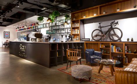 Bike Cafe Design, Bicycle Workshop Design, Bike And Coffee Shop, Bike Cafe Design Coffee Shop Bicycles, Bicycle Shop Design, Corner Seating Area, Coffee Workshop, Bicycle Workshop, Bike Shop Ideas