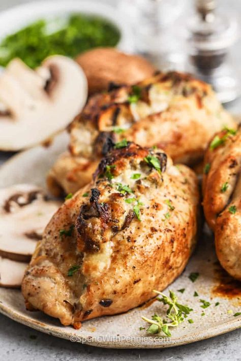 Make these mushroom stuffed chicken breasts for an impressive main meal. Chicken breasts are sliced open and filled with a filling made from mozzarella, cream cheese, and sauteed mushrooms. Add some crushed garlic, bacon, or even some feta cheese for added flavor. Baked in the oven these breasts are so juicy tender and cheesy! #mushroomstuffedchickenbreasts #chickenbreastsstuffedwithmushrooms #mushroomstuffedchickenbreastsrecipe #spendwithpennies Mushroom Stuffed Chicken Breast, Mushroom Stuffed Chicken, Mushroom Stuffed, Stuffed Chicken Breasts, Stuffed Chicken Breast, Cheese Stuffed Chicken, Spend With Pennies, How To Cook Mushrooms, Duck Recipes