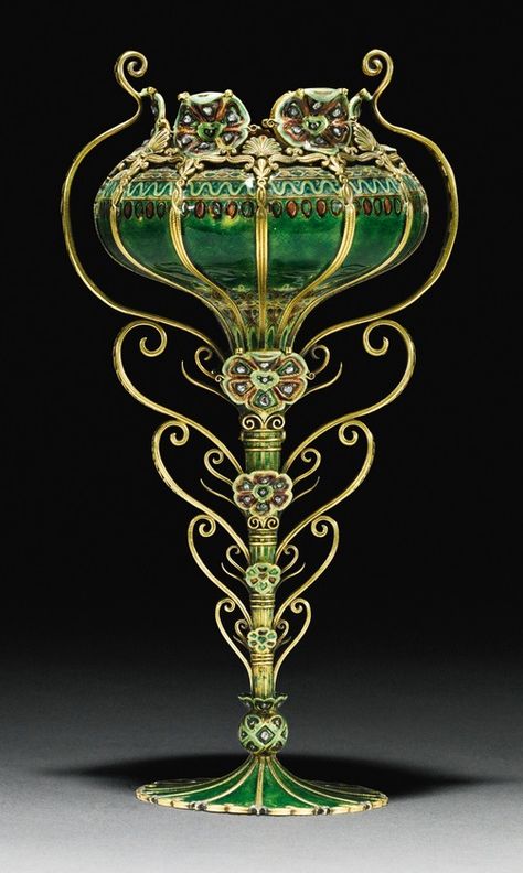 An Art Nouveau gold, diamond and enamel two-handled vase, Tiffany & Co New York, designed by Paulding Farnham for Paris Universal Exhibition, 1900. The underside applied with Tiffany & Co.'s special 1900 Exposition Universelle mark 18cm., 7 1/8 in high. #Tiffany #PauldingFarnham #ArtNouveau #vase Bijoux Art Deco, Design Art Nouveau, Art Deco Vases, Gold Vase, Art Nouveau Antiques, Tiffany Art, Art Deco Vase, Art Nouveau Art, Juice Cup