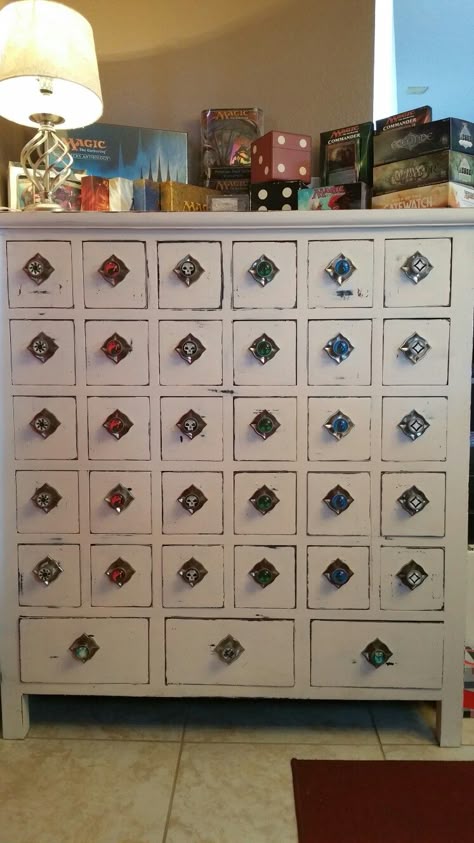 I turned an old apothecary cabinet into MTG storage! A great way to keep those cards organized and handy! Magic The Gathering Game Room, Magic The Gathering Room, Dnd Basement, Magic The Gathering Crafts, Dnd Game Room, Dnd Room Ideas, Old Apothecary, Dnd Room, Nerdy Decor