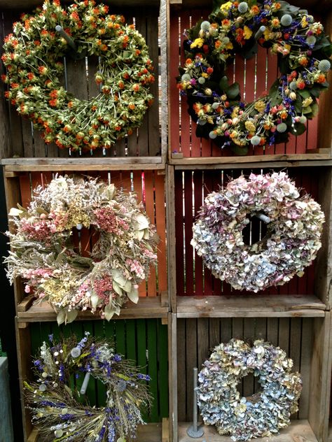 Wreath display at Terrain 8-25-13 Terrain Christmas, Displays For Craft Shows, Christmas Merchandising, Craft Show Display Ideas, Show Display Ideas, Fresh Wreaths, Wreath Display, Craft Fair Booth Display, Craft Show Booths