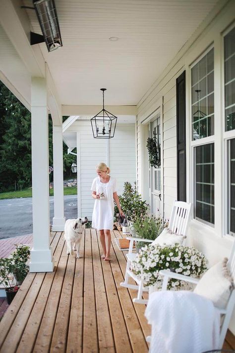 A favourite spot at our home is the front porch. It’s a beautiful place to sit in the morning and listen to the birds sing. In the evening,  the sun sets just right above and below the trees,  so Steve and I love to unwind from the day and watch the kids play up and down our long driveway. When… Long Verandah Ideas, Country Style Outdoor Area, Cottage Home Front Porch, Back Porch Inspiration Outdoor Living, Front Porch Ideas Large, Small Wood Front Porch Ideas, Styling A Long Front Porch, Front Porch White Rocking Chairs, Bungalow With Front Porch