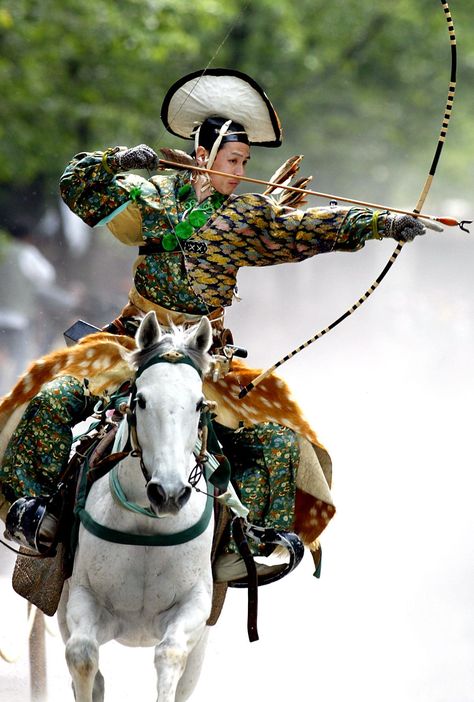 Shintoism - An archer dressed in traditional samurai garb displays Yabusame (archery while on horseback) during an annual demonstration of 13th century Japanese martial arts in Tokyo. Description from pinterest.com. I searched for this on bing.com/images Guerriero Samurai, Mounted Archery, Pencak Silat, Armadura Medieval, Japan Culture, On Horseback, Male Character, Bow And Arrow, Art Japonais