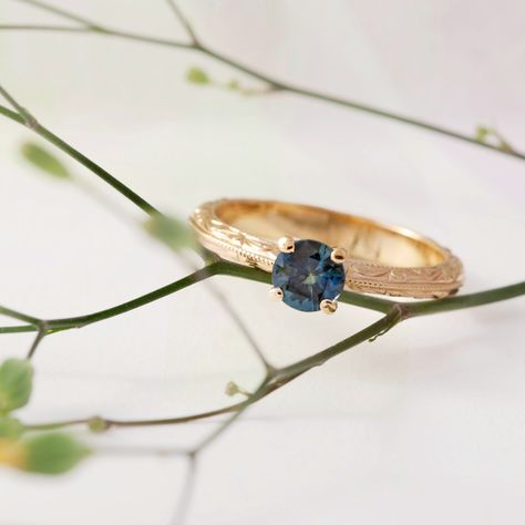 Our Lavine ring is handcrafted with 14kt yellow gold and features a round blue sapphire, with hand engraving and millgrain details along the band💙 This adorable ring is also on sale right now! #eradesignjewellery #uniqueengagmentring #womenownedbusiness #womanowned #ringinspiration #engagementringideas #engagementringinspiration #weddingjewellery #sapphireengagementring #vancouverbridal #shoplocalbc #shopvancouver Engagement Ring Inspiration, The Band, Engagement Rings Sapphire, Unique Engagement Rings, Hand Engraving, Blue Sapphire, Wedding Jewelry, Right Now, Sapphire