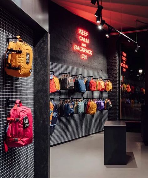 Bag Display Ideas Retail, Backpack Store, Clothing Store Interior, Urban Backpack, Clothing Store Design, Spain Design, Metal Grid, Grey Brick, Retail Store Design