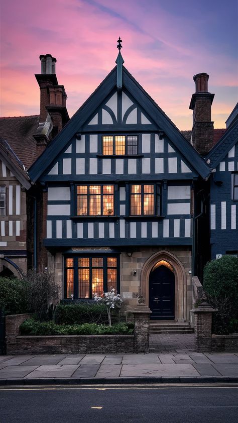 An image showcasing a Tudor-style house, inspiring you to infuse your space with Bridgerton-esque aesthetics. Colorful Tudor Exterior, Tudor Style Homes Floor Plans, Tudor Style House Exterior, French Home Exterior European Style, English Tudor Exterior, Tudor Revival House Exterior, Small Tudor Style Homes, French Tudor Style Homes, English Tudor House