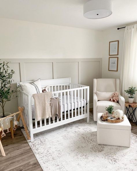 Embrace a clean and neutral aesthetic with this lovely gray nursery. Incorporate a gray board and batten wainscoting accent wall to add textural contrast to the smooth white walls. Add a simple white crib and comfy armchair to nurse your infant in your arms. Bright Accent Wall, Nursery Accent Walls, Closet Baby Room, Wainscoting Nursery, Cozy Baby Room, Nursery Accents, Nursery Accent Wall, Baby Nursery Inspiration, Baby Room Organization