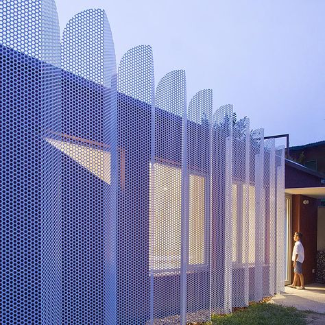 Architect and designer Francesca Perani has created a micro-apartment in Bergamo, Italy, that features a perforated metal screened facade. #MetalScreen #PrivacyScreen #Architecture #BuildingDesign Urban Cabin, Oriented Strand Board, Mini Apartments, Metal Facade, Micro Apartment, Road Bridge, Ancient Persian, Metal Screen, Italian Villa