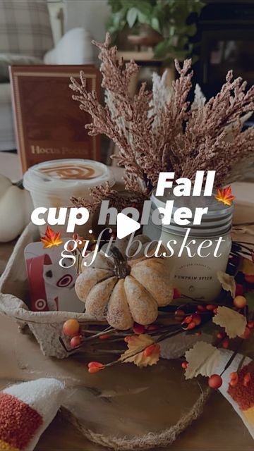 Ashley Hughes on Instagram: "Here’s a fall🍁 inspired version of my viral “cup holder” gift basket!

The perfect “thinking of you” gift for any birthday, wedding, shower, get well etc!

I love to place some kind of florals, candle, gift card & drink into each holder🫶🏻

Also… the @antiquecandleco_ candles fit PERFECTLY inside these cardboard cup holders & they just released a ton of fall scents!! (they are linked in my bio!)👆🏻" Cup Holder Gift Basket, Drink Holder Gift Basket, Cup Holder Gift Idea, Cup Holder Ideas, Fall Gift Basket Ideas, Fall Basket Ideas, Ashley Hughes, Drink Basket, Friendsgiving Ideas