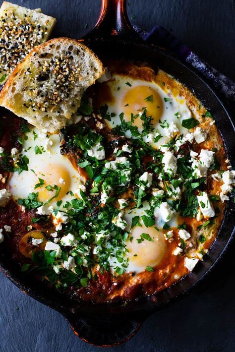 A hearty and smoky vegetarian shakshuka recipe loaded with sauteed kale, mushrooms and peppers. The tomato is seasoned with deep spices of cumin and paprika and once the dish is just done cooking, everything is topped with creamy feta and lots of fresh herbs. Vegetarian Shakshuka, Kale Feta, Tahini Sauce Recipe, Homemade Tahini, Shakshuka Recipes, Sauteed Kale, Herb Recipes, Kale Recipes, Egg Recipes For Breakfast