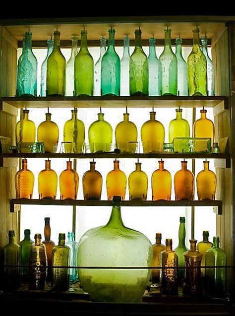 Glass bottles   - Explore the World with Travel Nerd Nici, one Country at a Time. http://TravelNerdNici.com Vintage Bottle Display Ideas, Bottle Collection Display, Bottle Display Ideas, ขวดโหล Mason Jar, Vintage Bottles Decor, Decorative Glass Bottles, Colored Bottles, Colored Glass Bottles, Old Glass Bottles