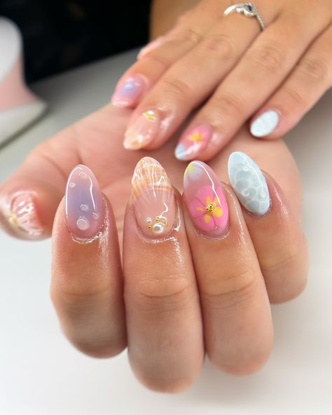 summer freestyle for maddie 🌺🫧🐚 i’m actually so in love with how this set turned out omg and it was so fun to make the water nail likeeee look how realistic?? love. #nails #nailart #summernails #summer #gelx #gel #gelnails #vbeautypure #apresgelx #après #vbp #nailinspo #nailinspiration #gelextensions #almondnails Glazed Nails Design, Nails Different Designs Each Finger, The Summer I Turned Pretty Nails, Water Nail Designs, Gel Nail Designs Natural Nails, Short Gel X Nail Designs, Summer Nails Jelly, Nail Art Summer 2024, Nail Summer Ideas