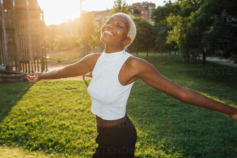 Happy woman with arms outstretched spinning at meadow stock photo Woman With Arms Outstretched, Happy Woman, Reverse Image Search, Happy Women, Model Release, Drawing Inspo, Painting Inspiration, Picture Perfect, Royalty Free Images