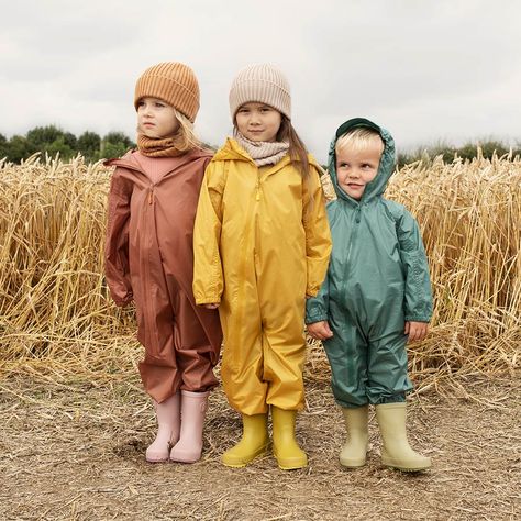 When the weather can't be relied upon, our brand new Packaway Rain Suit can. Made from recycled polyester, it's lightweight and breathable but fully waterproof, so the heavens may open, but they can't spoil your plans. There's a lovely looooong zip all the way to the knee, so it's easy to get on, with an elasticated waist, cuffs, ankles and peaked hood for a comfy fit. Cleverest of all, it packs away in seconds into its own integrated pouch.  Colour: Copper (Brown). Size: 4-5 years. Curry Yellow, Kids Studio, Chunky Knit Jumper, Rain Suit, Copper Brown, Washing Line, Life Aesthetic, Winter Layering, Pine Green