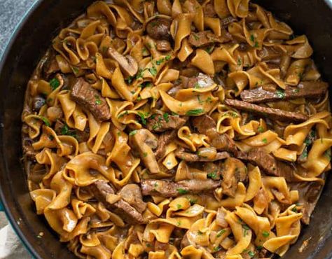 The tender beef and creamy rich sauce of Beef Stroganoff only get's better when prepared in a Dutch ... - Provided by Outside Nomad Beef Tips In Dutch Oven, Dutch Oven Beef And Noodles, Dutch Oven Stroganoff, Beef And Noodles Dutch Oven, Dutch Oven Beef Stroganoff, Beef Stroganoff Dutch Oven, Dutch Oven Beef, Dutch Oven Camping Recipes, Dutch Oven Camping