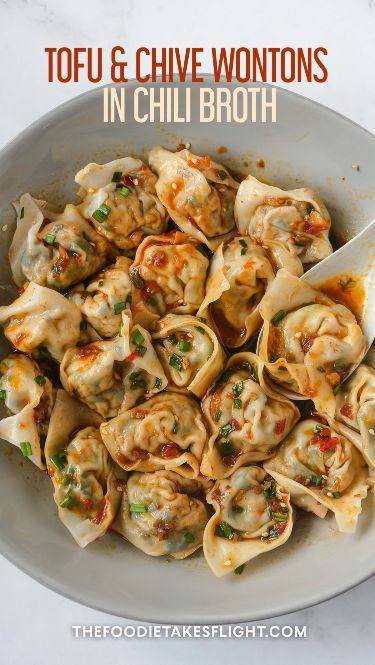 Homemade Tofu and Chive Wontons filled with homegrown garlic chives from my garden! I used frozen tofu that creates this much meatier texture. I boiled my wontons but you can also steam or even deep fry yours. I served my wontons with an aromatic chili broth. Asian Cooking Recipes, Vegetarian Wontons, Frozen Tofu, Tofu Meals, Firm Tofu Recipes, Tofu Food, Chive Dumplings, Homemade Tofu, Vegan Tofu