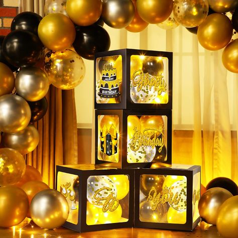 PRICES MAY VARY. Gold and Black Party Decorations Set: you will receive 4 pieces birthday balloon boxes with letters, each measures 11.8 x 11.8 x 11.8 inch, 8 pieces birthday cards with 2 sheets glue point dots, 35 pieces 5 inches balloons and 4 pieces 3.3 feet long warm white string lights, great for gold and black birthday party decorations Classic Design: the gold and black balloon boxes feature black transparent design, with "happy birthday to you" letters, and patterns like gift box, birthd Black And Gold Balloon Ring Backdrop, Black And Gold Table Balloons, Black And Gold Theme Party Amazon.com, Black And Gold Centerpieces Birthday Target, Gold And Black Party Decorations, Gold And Black Party, Gold And Black Birthday, Balloon Boxes, Black Party Decorations