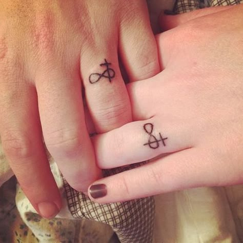 Wedding Ring Tattoos / http://www.himisspuff.com/wedding-band-ring-tattoos/2/ Tattoo Marriage, Tatoo Ring, Cross Finger Tattoos, Marriage Tattoos, Knitting Tattoo, Tato Salib, Ring Tattoo Designs, Wedding Band Tattoo, Tattoo Wedding