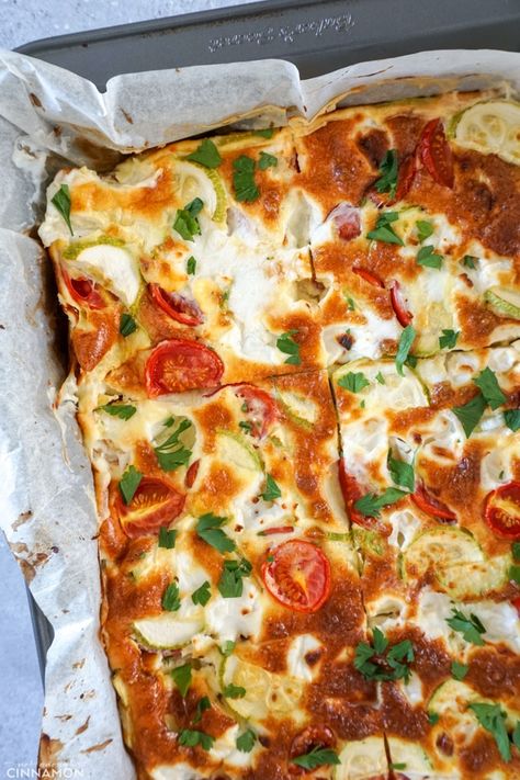 Baked Frittata in a metal square pan lined with parchment paper. Oven Baked Frittata, Cheese Zucchini, Tomato Frittata, Baked Frittata, Cherry Tomato Recipes, Sweet Potato Kale, Cheese Frittata, Parmesan Zucchini, Cherry Tomato