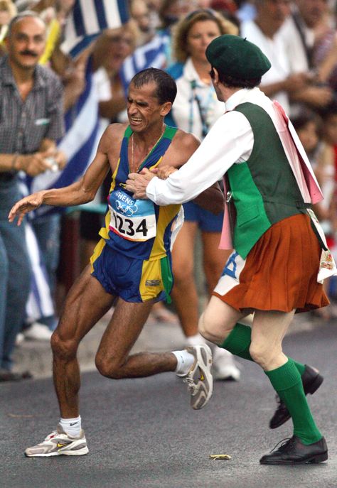 Vanderlei de Lima of Brazil is attacked by Cornelius Horan, a deranged Irish former priest in the latter stages of the marathon, the final event of the Athens 2004 Olympics. The Brazilian, who was expected to win the gold, finished in third place winning the bronze. Paolo Rossi, 2004 Olympics, John John Florence, Kelly Slater, The Marathon, Third Place, Usain Bolt, Michael Phelps, Olympic Athletes