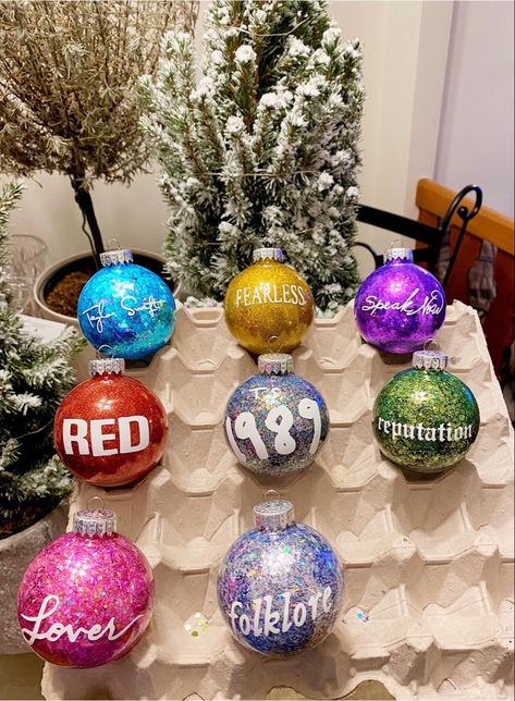 Homemade Taylor Swift Christmas Tree Ornaments #taylorswift #christmasdecor #christmas #fearless #speaknow #red #1989 #reputation #lover #folklore #taylorswiftreputation #taylorswiftlover #swiftie #swifty #handmade #handmadehomedecor #homedecorideas #cricut #cricutmade #cricutmakerprojects Homemade Taylor Swift Merch, Taylor Swift Baubles, Christmas Gifts For Taylor Swift Fans, Taylor Swift Tree Ideas, Taylor Swift Eras Tour Ornament, Taylor Swift Xmas Tree, Swiftmas Tree Ideas, Taylor Swift Lover Gift Ideas, Taylor Swift Gift Ideas Christmas