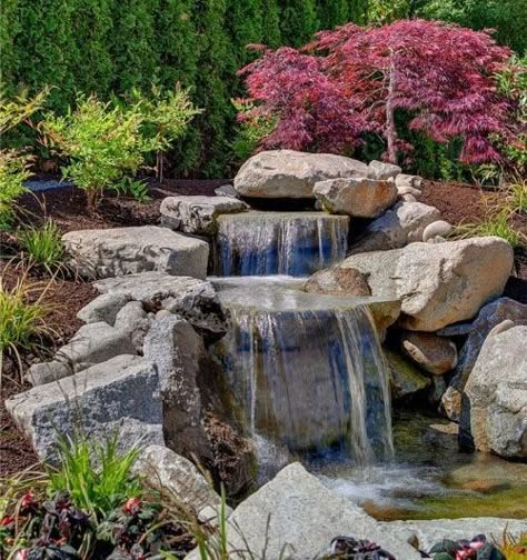 Backyard rock waterfall ideas #backyardwaterfalldesignideas Pond Waterfalls, Waterfall Designs, Small Garden Waterfalls, Waterfall Landscaping, Kolam Koi, Garden Pond Design, Rock Waterfall, Waterfall Pictures, Ikan Koi