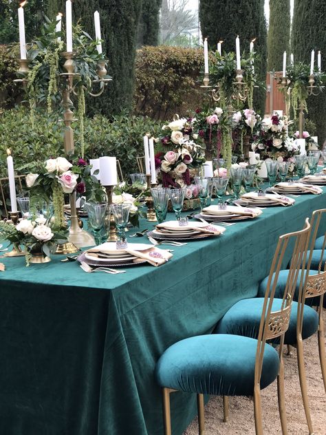 Elegant royal-themed tablescape with jewel tones and gold accents #tablescapes #jeweltones #candelabra #centerpieces #longtable #decor #chameleonchairs Green Velvet Christmas Table, Royal Green Wedding Theme, Royal Theme Wedding, Teal Wedding Decorations, Jewel Tone Wedding Theme, Jewel Tone Wedding Colors, Candelabra Centerpieces, Emerald Green Wedding Theme, Green Wedding Decorations