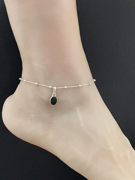 "GENUINE ETHIOPIAN BLACK FIRE OPAL ANKLET Sterling Silver Petite natural Ethiopian Opal Anklet Minimalist and Dainty Beaded Petite Opal Anklet Chain ANKLET FEATURES: Metal:  All components are made from solid .925 Sterling Silver  Model is wearing 10\" in length  solid .925 Sterling Silver Bead Chain Chain Length:  9 inch + 1 inch extension  Please send me a message if you have any questions before or after placing your order. Please also view my policy before purchasing.  Please visit my storef Opal Anklet, Black Anklet, Triquetra Necklace, Trinity Necklace, Black Fire Opal, February Birthstone Jewelry, Anklet Chain, Geode Necklace, Silver Model