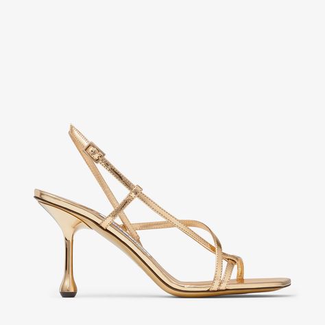 A sculptural design with a graphic drop heel, the Etana sandal is modern update to a wardrobe classic. Crafted from leather with a metallic finish, this statement design features crossover straps and an adjustable fastening. Jimmy Choo Gold, Jimmy Choo Heels, Monk Strap Shoes, Wardrobe Classic, Leather Lingerie, Ballet Pumps, Boot Pumps, Jimmy Choo Shoes, Footwear Design Women