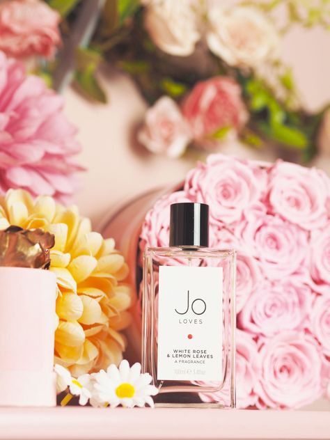 Jo Loves 'White Roses & Lemon Leaves' perfume. Perfume photography inspiration, fragrance photoshoot ideas. Jo Loves packaging. It’s rich with roses and opulence, but it’s zesty and fresh with the scent of foliage and hints of lemon. Jo Loves perfume, Jo Loves fragrance.  #fashionforlunch #jolovesperfume #joloves #perfumereview Jo Loves Perfume, Fragrance Photoshoot, Replica Perfume, Amber Oil, Jo Loves, Product Photoshoot, Hermes Perfume, Lemon Leaves, Perfume Photography