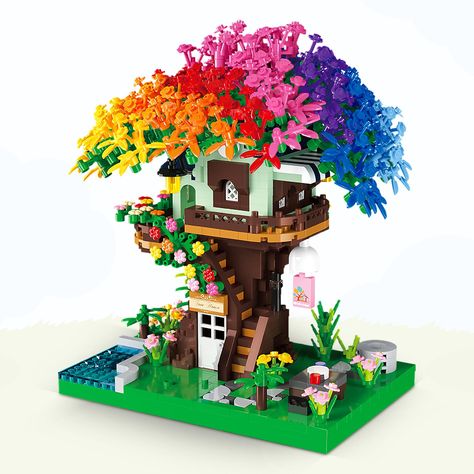 PRICES MAY VARY. Tree house building blocks are composed of 1528pcs mini building kit, the amount of work is huge and more challenging, and enough patience to assemble it.and the assembly manual is in the package, please read it patiently. Safe Quality Material: Crafted from ABS plastic bricks that are durable non-toxic and green materials, with bright colors, good flexibility and not easy to damage. Unique Design： Architecture rainbow tree Building Blocks equipped with LED light effects make ou Lego Trees, Lego Tree, Tree Building, Plastic Bricks, Mini Building, Rainbow Tree, Lego House, House Building, Colorful Trees