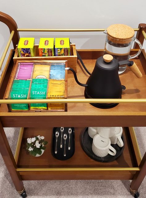 Tea bag organizer, gooseneck electric kettle, marble tray, wooden and golden bar cart. Small Coffee Tea Station, Tea Set In Bedroom, Tea Corner In Living Room, Tea Tray Display Coffee Stations, Small Tea Corner Ideas, Tea Station Office Desk, Bar Cart Tea Station, Bar Cart For Coffee, Small Tea Bar Ideas