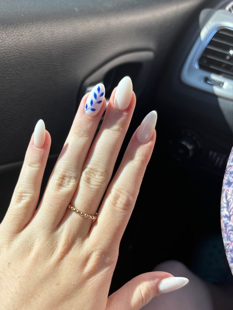 White Almond Acrylics with Royal Blue Accent White And Blue Nail Inspo Acrylic, Royal Blue And White Nails Designs, White And Blue Nails Short, White Nails Blue Design, Royal Blue And White Acrylic Nails, White And Royal Blue Nails, Blue And White Almond Nails, White Nails With Blue Design, Royal Blue Almond Nails