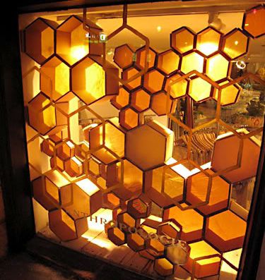 Hexagon shelving in Anthropologie, Moregeous Design Blog 1940s Apartment, Store Front Windows, Bee Inspired, Hexagon Design, Store Window, Bee Art, Shop Window Displays, Store Displays, Display Design